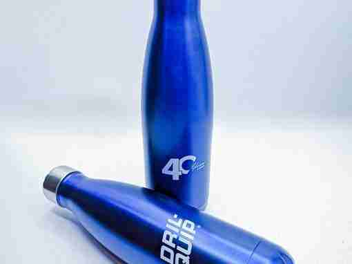 Blue Stainless Steel Water Bottles Two blue stainless steel water bottles with silver caps, one upright and one tilted.