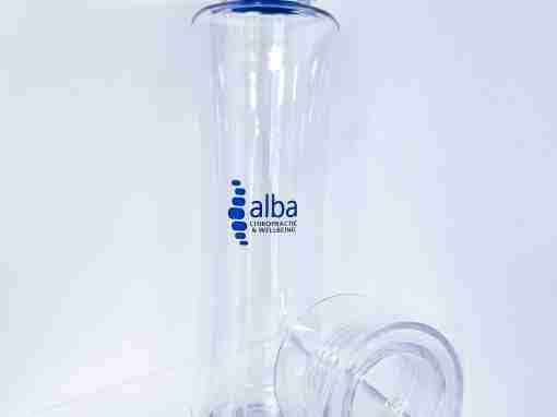 Clear Plastic Water Bottle with Blue Cap Transparent water bottle with a blue cap and alba logo on the side.
